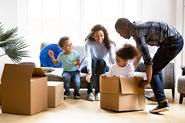 Family packing boxes for long distance move