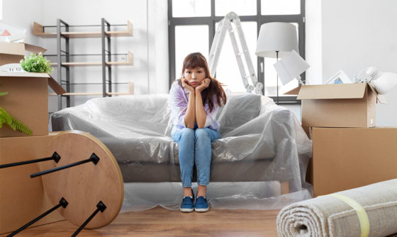 Woman feeling the stress of moving out after a breakup